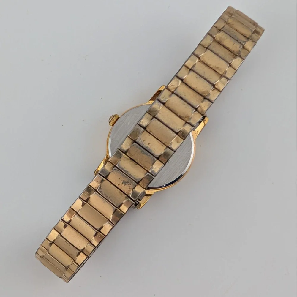 Vintage Seiko 1N00-0F60 Blue Woven Grid Textured Dial Gold Tone Watch 20mm